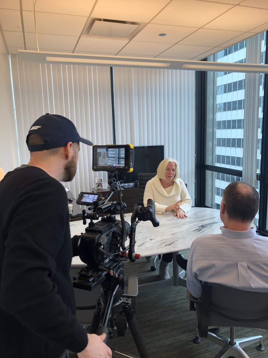 Boom operator recording an office interview