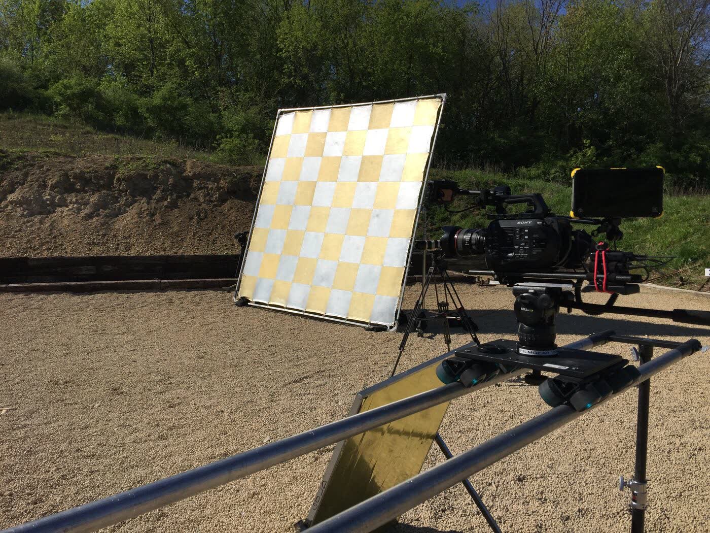 Camera slider and reflector set up outdoors