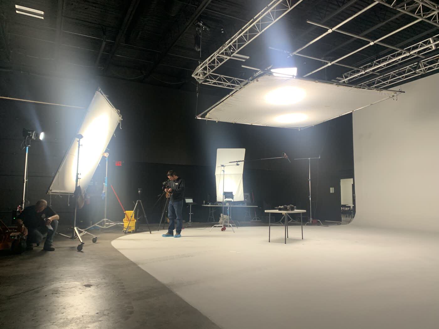 Wide view of the crew working in a studio cyc